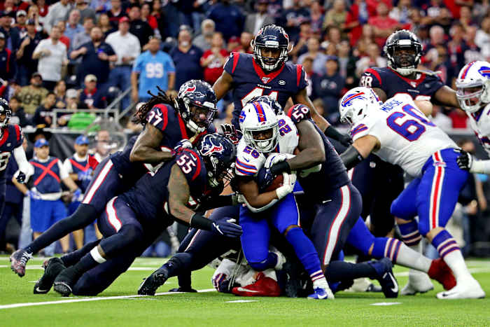 Texans outside linebacker Whitney Mercilus (59) tackles Bills running back Devin Singletary (26) during the AFC Wild Card Playoff game on Jan. 4, 2020.
